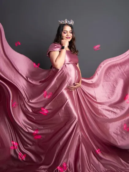 This is one of my absolute favorite shots. We use flowing gowns and special techniques to create a sense of magic and movement, making you feel like the queen you are. This is what a dreamy maternity portrait is all about.