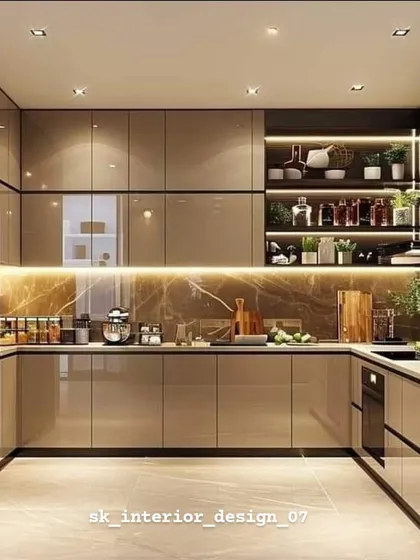 A luxurious U-shaped kitchen with glossy beige cabinets and a brown marble backsplash. The integrated lighting under the cabinets and in the open shelves creates a warm, inviting ambiance.