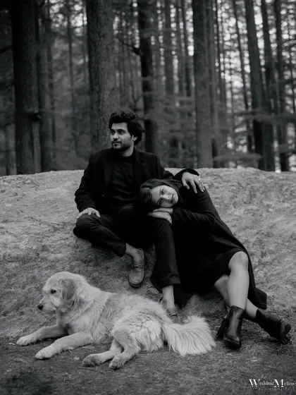 A peaceful moment in the Manali woods, complete with a furry friend. This relaxed portrait shows the couple at ease in nature, creating a warm and personal pre-wedding memory.
