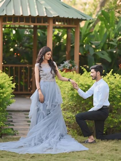 A classic proposal shot. The layered grey tulle of the gown spreads out beautifully, creating a perfect fairytale picture for this special moment.