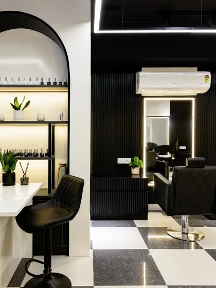 In a salon, elegance must meet function. This manicure station features a striking arch backdrop to display nail colors, creating a playful yet sophisticated focal point. The design balances symmetry and clean lines for a calm, captivating oasis.