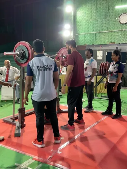 On the platform at the PI National Open. This shot captures the intensity of the competition environment. Even with a serious ankle injury, Khushi showed up ready to perform, a testament to her mental toughness.