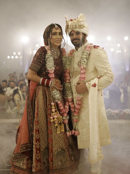A happy moment between the bride and groom. Her makeup is designed to last through all the smiles and happy tears of the wedding day.