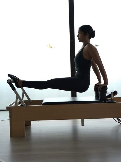 This exercise on the Reformer is fantastic for building tricep and shoulder strength while maintaining a stable core. It demonstrates how Pilates provides a full body workout.