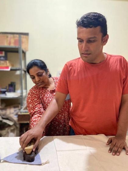 A young man from our Asha Foundation partnership receives guidance from our team. These vocational training sessions are about more than just craft; they are about building confidence and community.