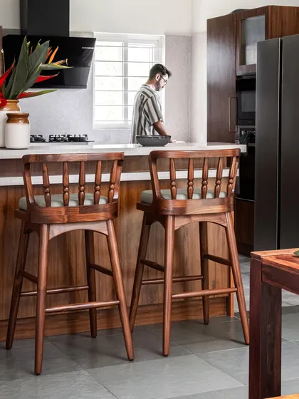 Pieces from the Dhara Residence, including the Ruba Bar Chair, Sirutha console, and Ruba armchair. This project highlights our ability to create contemporary yet warm furniture that complements modern architecture.