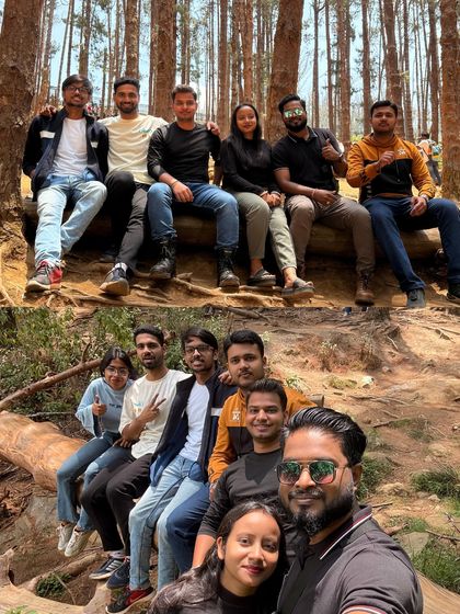 A group relaxing on a fallen log in the pine forests of Ooty. It’s these simple, happy moments that make a trip memorable.