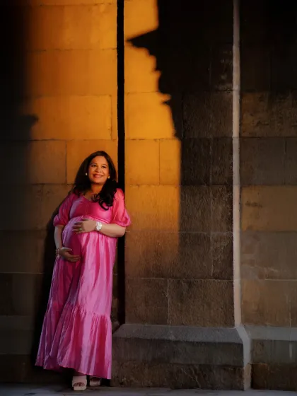I love playing with light and shadow to create something truly cinematic. Here, the golden hour light catches Anisha, creating a dramatic silhouette that highlights her strength and the miracle she holds. This is a fine art maternity portrait that feels both powerful and intimate.