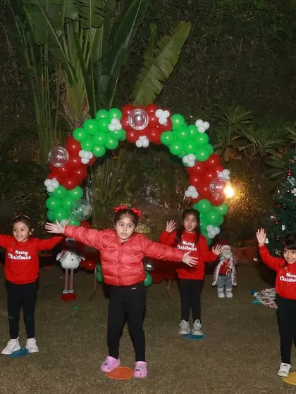 Spreading holiday cheer. Our Ghaziabad batch performing at a Christmas show, dressed in festive red.
