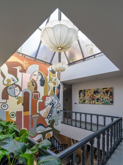 Looking down from the upper level, you can see how the mural connects the different spaces of the home. The composition is designed to be appreciated from multiple viewpoints, revealing new details from every angle.