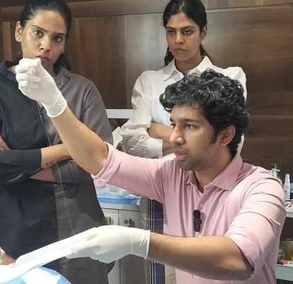 Explaining the nuances of thread placement to a group of dermatologists. Sharing knowledge and elevating the skills of my peers is a responsibility I take very seriously, ensuring the entire field maintains high standards of care.