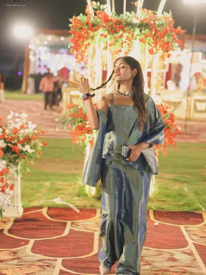 A playful, confident pose captured during a Sangeet night. My outfits are chosen to be both stylish and comfortable, allowing me to move freely and bring my full energy to the stage.