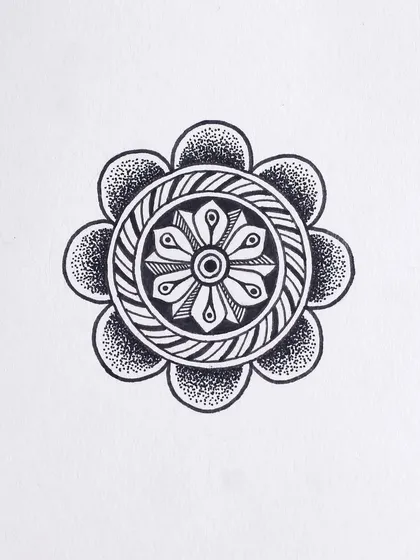 A small, circular motif with a woven texture in the center. This was part of my daily drawing practice for the Inktober challenge.
