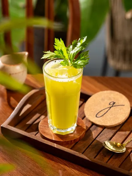 A fresh celery juice captured in bright, natural light. This style is perfect for health cafes and wellness brands.