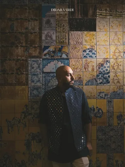 A moody shot against a wall of traditional Moroccan tiles. The artistry and craftsmanship here is on another level.