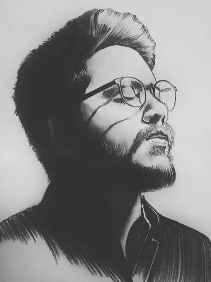 A dramatic portrait created with graphite on A4 paper. I used strong light and shadow to create a high-contrast, moody piece that has a different feel from my other portraits.