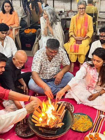 Our community members participating in a havan, a sacred fire ritual, during the Ganesh Chaturthi puja. We sit together to offer prayers, strengthening our bonds as a studio family.