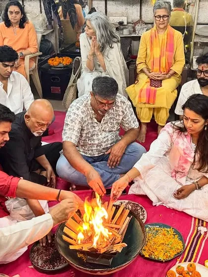 Our community members participating in a havan, a sacred fire ritual, during the Ganesh Chaturthi puja. We sit together to offer prayers, strengthening our bonds as a studio family.