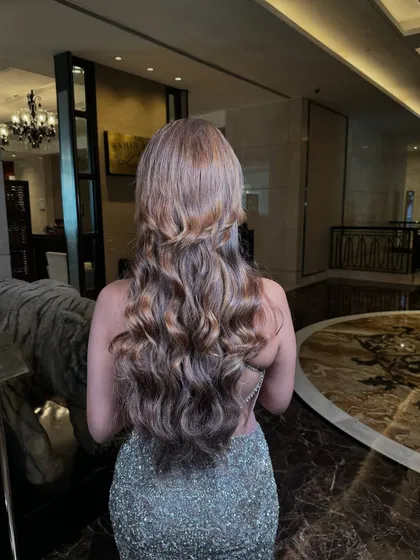 A beautiful hairstyle for a glamorous evening look. These soft, flowing waves are perfect for a reception or cocktail party.