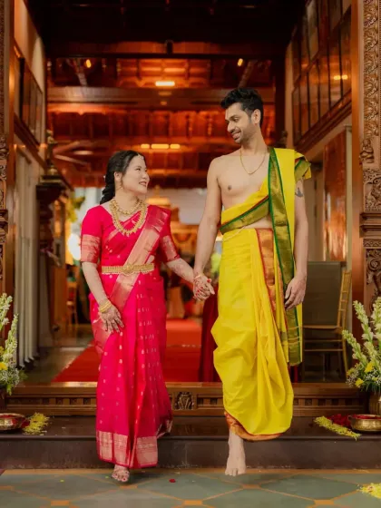 Hand in hand, Anirudh and Lisa step forward into their new life together after their beautiful South Indian wedding ceremony.
