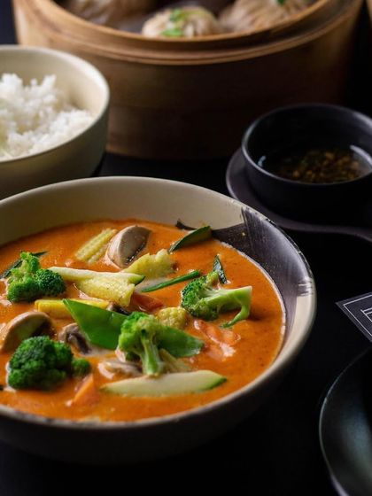 Our culinary offerings are a symphony for your taste buds. This Thai red curry with fresh vegetables is a comforting and flavorful main course, perfect with a side of jasmine rice.