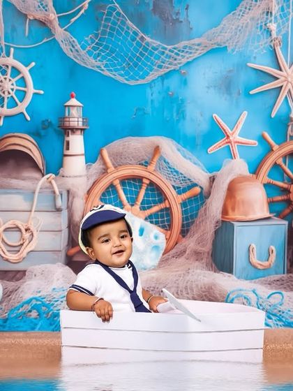 A wide shot of the complete nautical setup. I take care of every detail, from the sandy floor to the starfish and ship's wheels, to create a fully immersive experience.