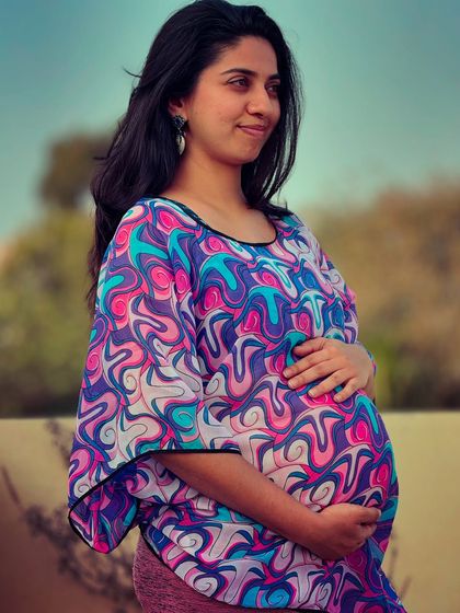 A candid moment at 30 weeks, feeling the sunshine and embracing the final stretch of pregnancy.