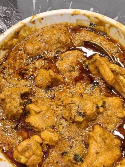 A bowl of my rich mutton curry, with the oil separated from the masala, a sign of a well-cooked gravy.