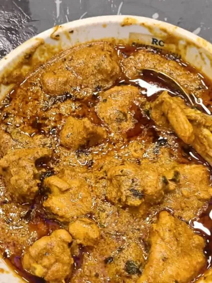 The final product: a rich and oily chicken curry that is perfect with fresh naan or roti.