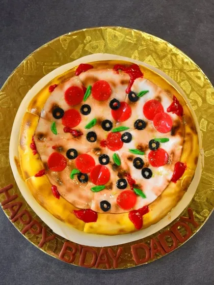 Is it a pizza or is it a cake? This is my popular illusion cake, designed to look exactly like a pepperoni and olive pizza. Underneath the realistic fondant toppings and airbrushed crust is a decadent Nutella chocolate chip cake, offering a fun and delicious surprise.