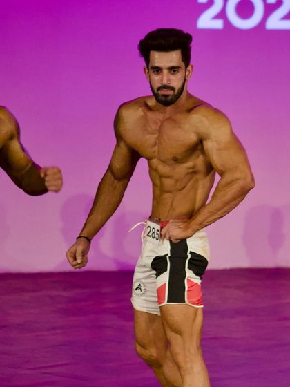 Another shot of my client on the Musclemania stage.