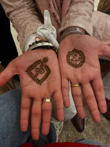 Mehandi for the groom is an important tradition. I create simple yet meaningful designs, like these featuring religious symbols and the couple's wedding hashtag, for a touch of elegance on the big day.