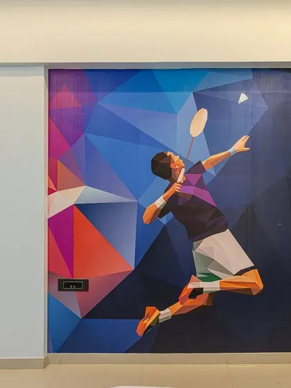 For a young badminton enthusiast, I used a custom geometric wallpaper to create a dynamic and energetic feature wall. It’s a great way to personalize a room based on a child's passion.
