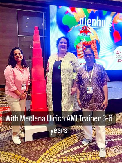 Our team with AMI Trainer Medlena Ulrich in front of the iconic Pink Tower at the Nienhuis Retreat.