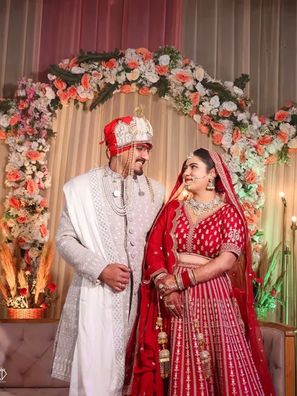 A candid moment on stage as the couple looks at each other, forgetting the camera for a second.