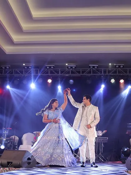 The couple takes center stage for a dance, with professional stage lighting and sound systems that we manage to create a concert-like experience.