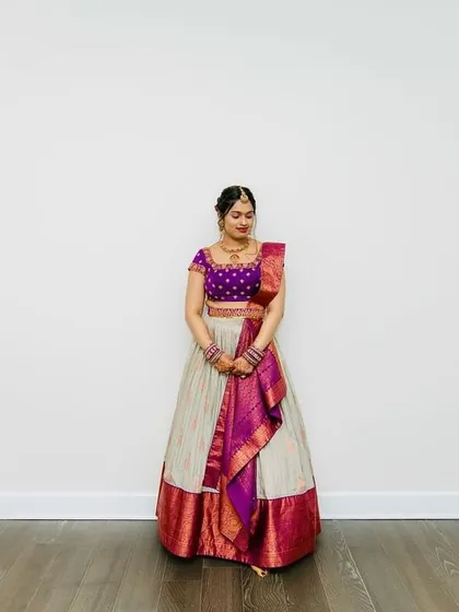 Another beautiful shot of the bride in her bespoke lehenga, radiating happiness and grace.