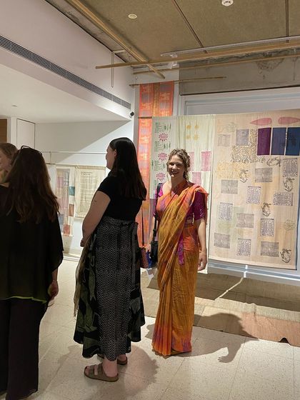 Glimpses from our "We Together Work" exhibition, where hand-printed textiles hang like art. These panels, created with the Bábbarra Women's Centre, tell ancestral stories through the medium of fabric.