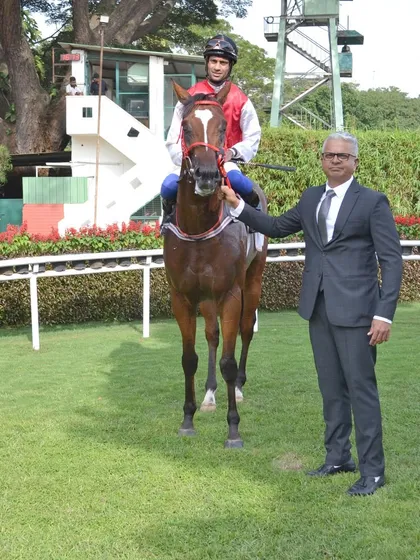 A champion in the making. Here is Positano, winner of The Governor's Cup, with trainer S.S. Attaollahi in the paddock. This is a behind the scenes look at the moments before the celebration.