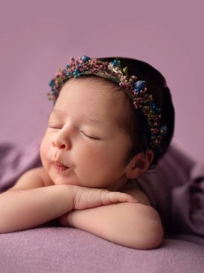 Such a precious pursed-lip expression. I love capturing these tiny, fleeting mannerisms that showcase your baby's budding personality.
