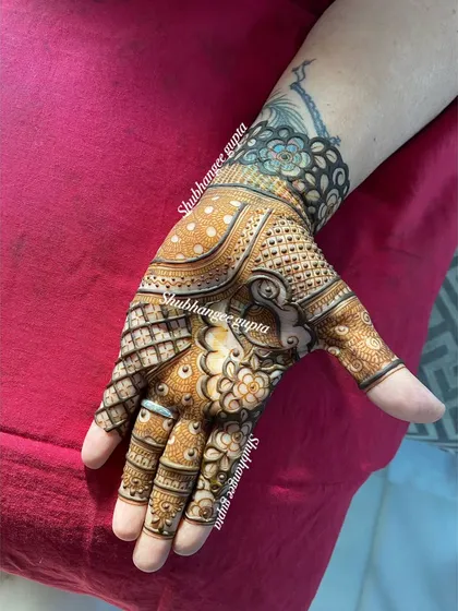 This design features a mix of different patterns on each finger, creating a unique and eye-catching effect. The main design on the palm is bold and beautiful.