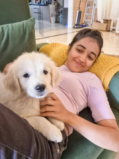 Learning to be a human couch is a key skill for any puppy trainer. Gentle handling and positive association from a young age are fundamental to my puppy training programs.