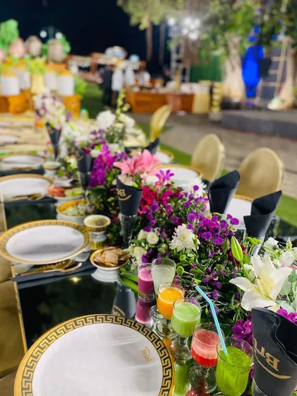 The beautiful tablescape, with vibrant floral arrangements and a rainbow of fresh juices.