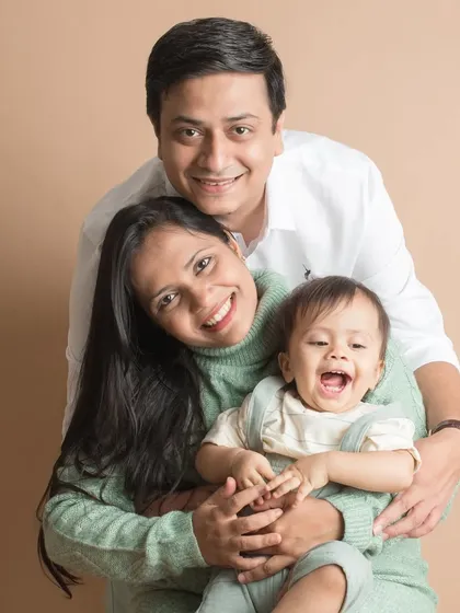 A beautiful family of three, their joy lighting up the studio. This portrait is a simple, timeless capture of their love and connection.