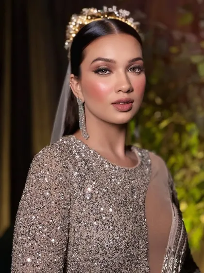 Party makeup is all about making a statement. Here, I created a full glam look with a flawless, sparkling base, defined eyes, and a sophisticated updo. This style is perfect for guests attending a wedding or any special celebration where you want to shine.