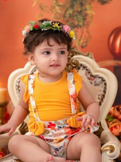 A close-up portrait from the autumn shoot. The soft lighting and warm colors beautifully highlight her sweet expression.