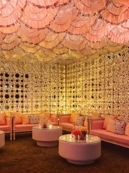 I transform spaces into breathtaking experiences. This Sheesh Mahal inspired lounge, with its intricate mirror work and soft, warm lighting, creates an unforgettable, luxurious ambiance for any celebration.