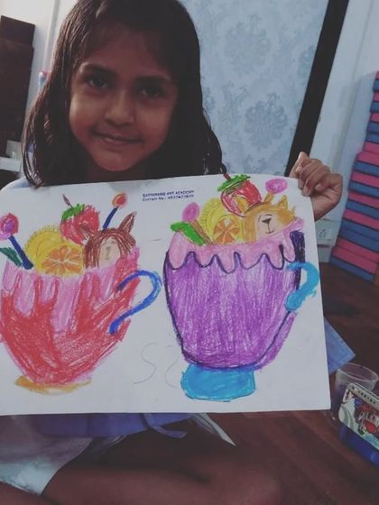 Krishika, a 2nd standard student, drew these imaginative ice cream glasses with cute animals inside. This creative drawing was done with oil pastels on paper.