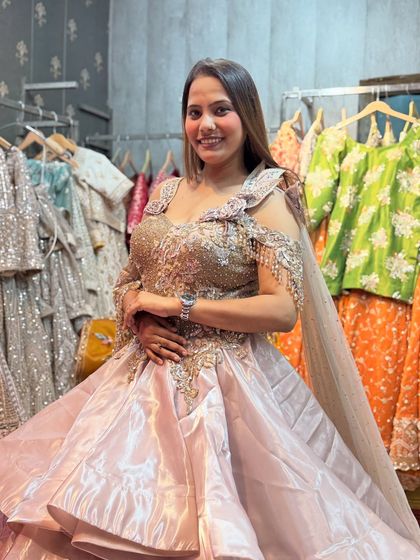 A happy client looking like a princess in our multi-layered gown. Renting an outfit like this means you get the wow-factor without the hefty price.