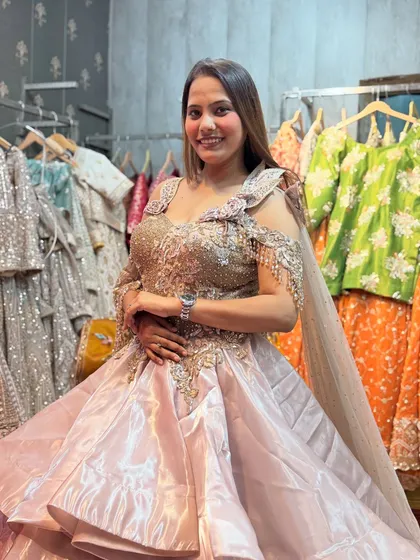 A happy client looking like a princess in our multi-layered gown. Renting an outfit like this means you get the wow-factor without the hefty price.